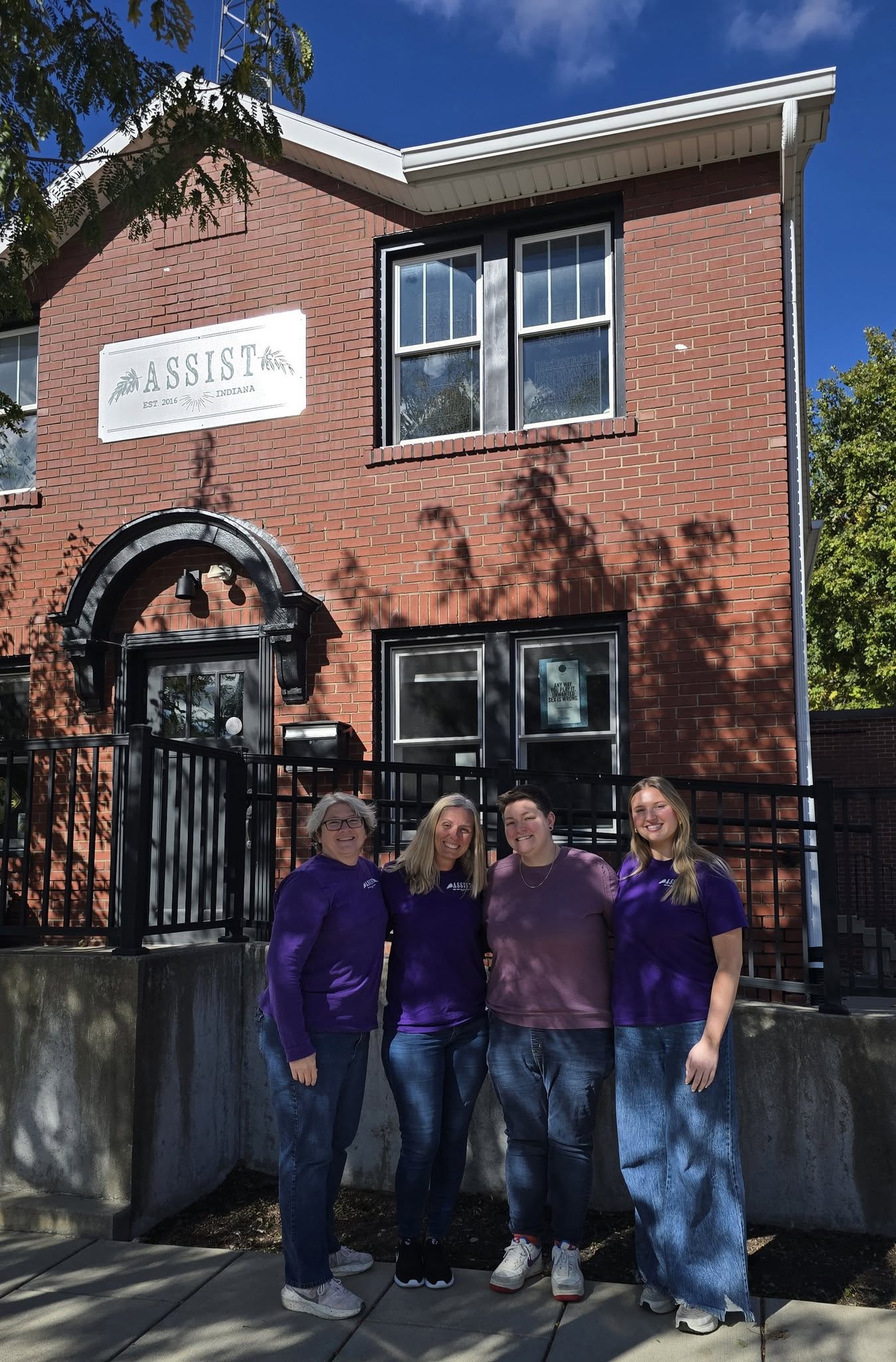 Members of the ASSIST team stand outside our building in Franklin