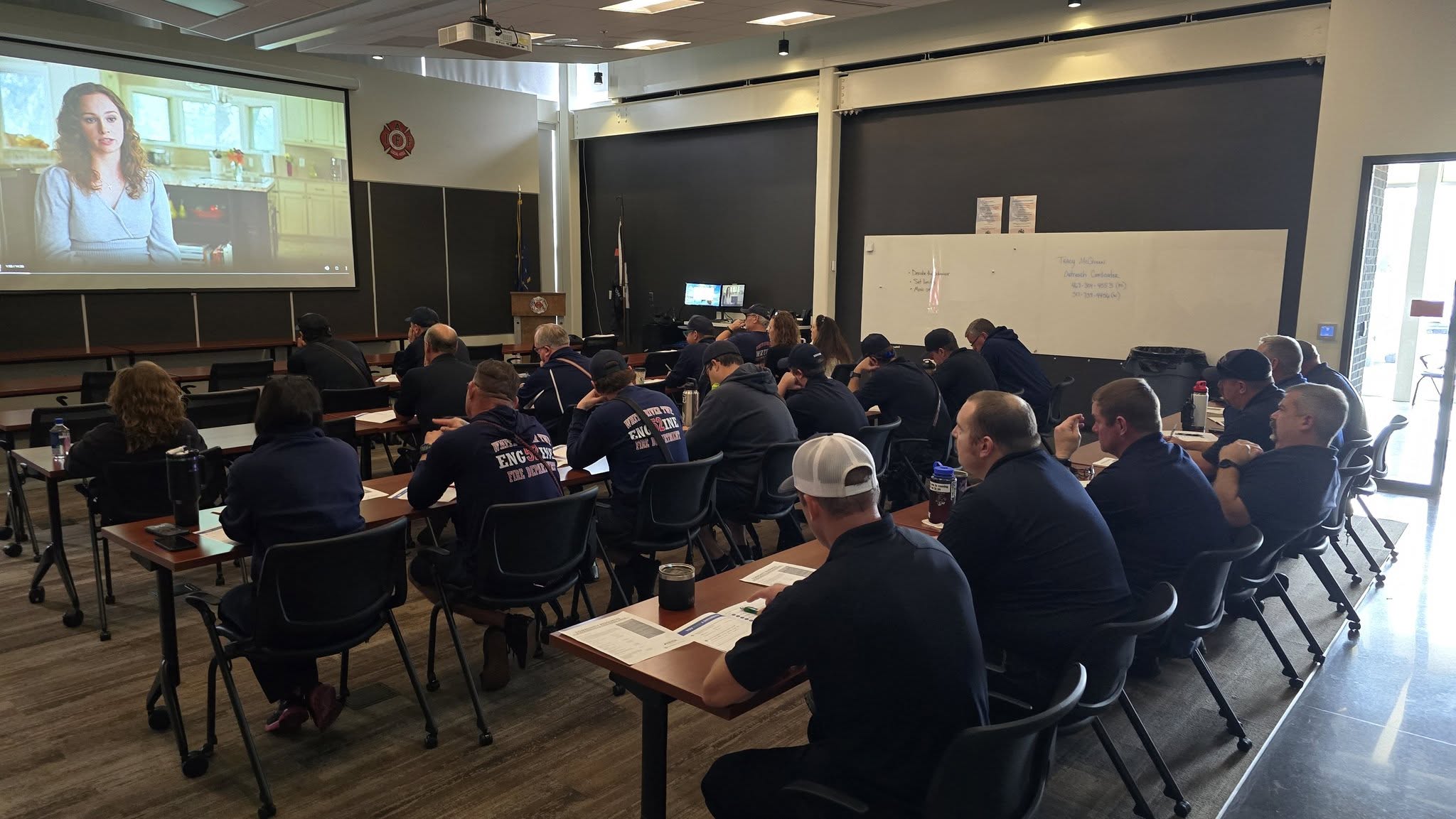 Members of the White River Valley Fire Department watch a video during a prevention training