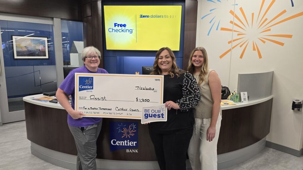 Centier Bank staff presenting a $1,250 Centier Gives check to ASSIST